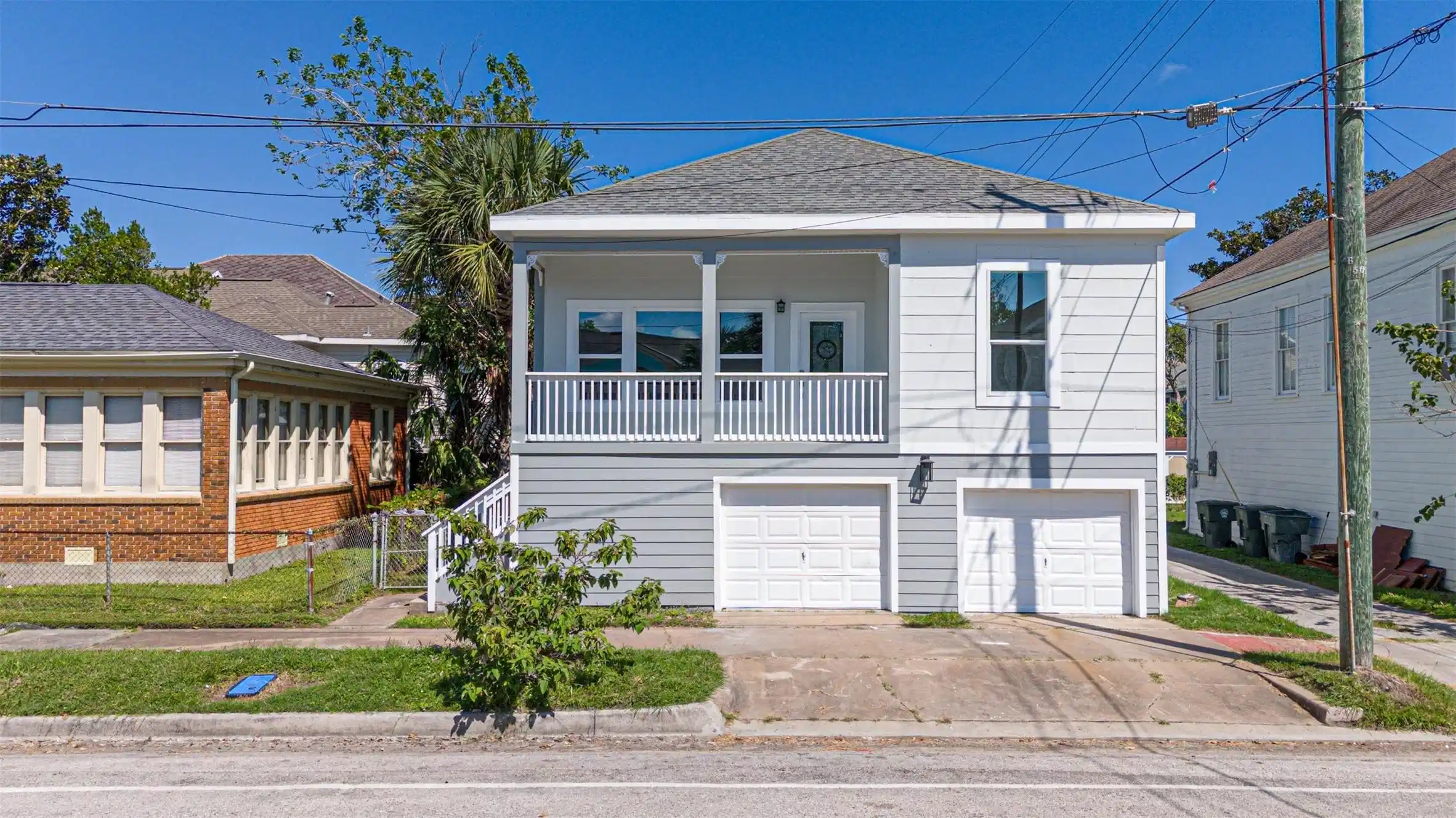 Image 1: This home features a raised two-story design with