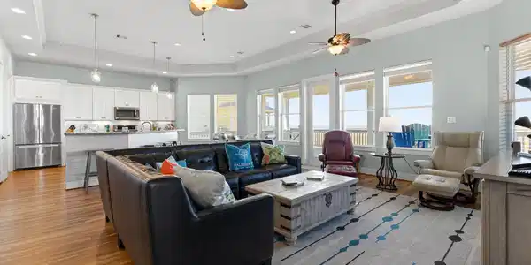 Image 4: Light-filled living area with soaring ceilings, cr