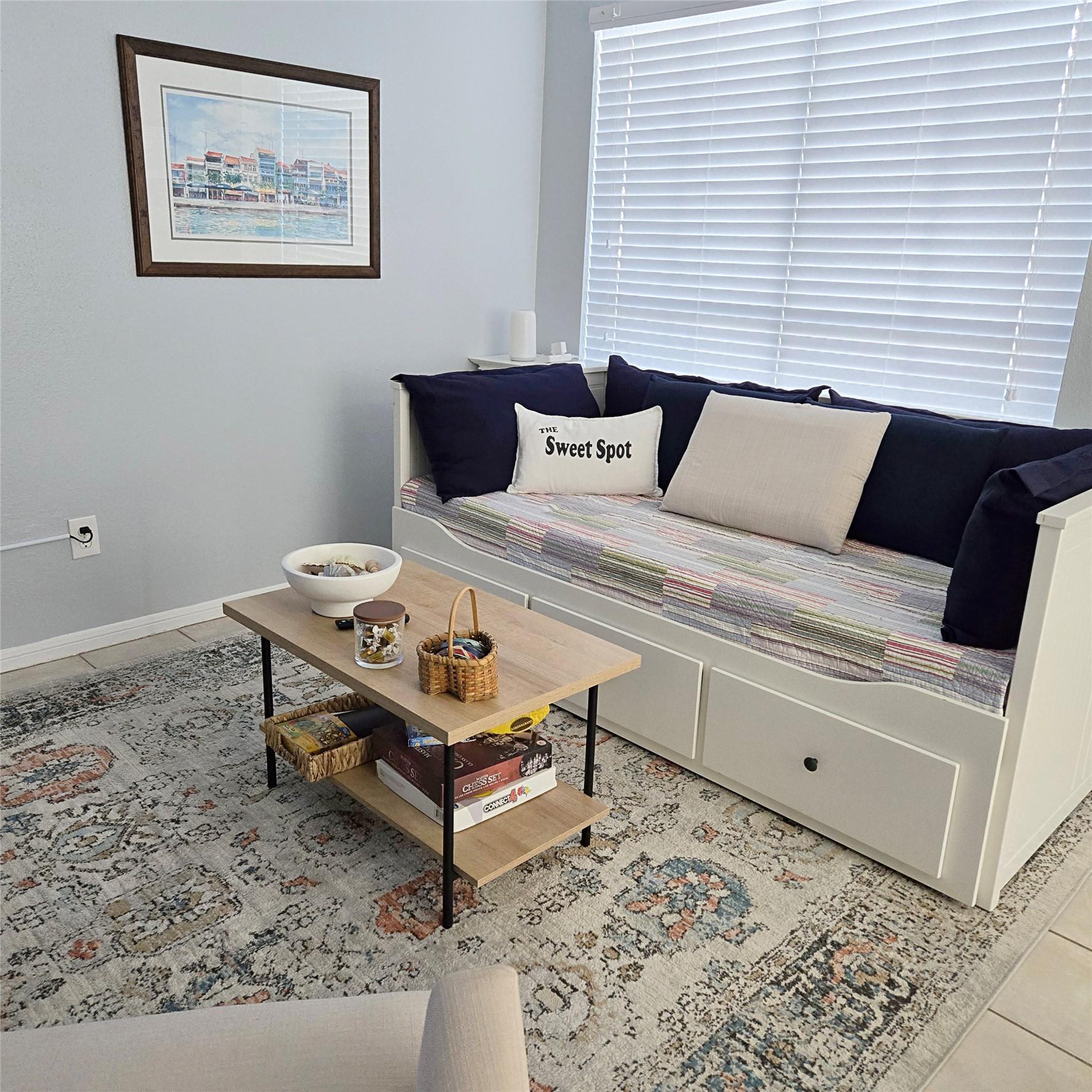 Image 3: The large window fills the space with soft, natura