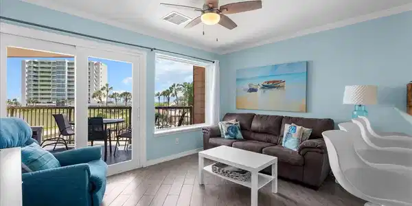 Image 4: Bright and inviting living room overlooks the spar