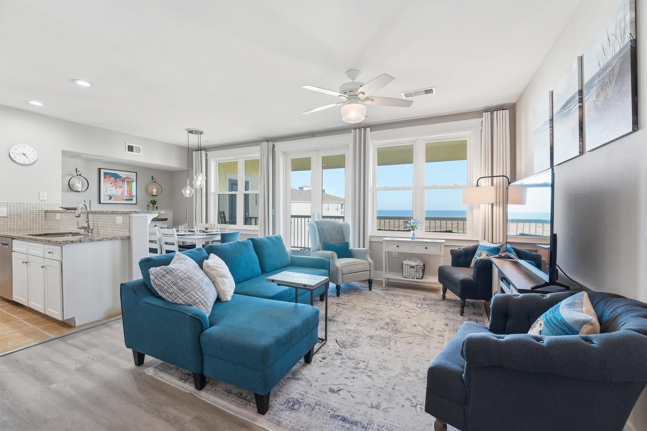 Image 3: Natural light fills the open-concept layout, creat