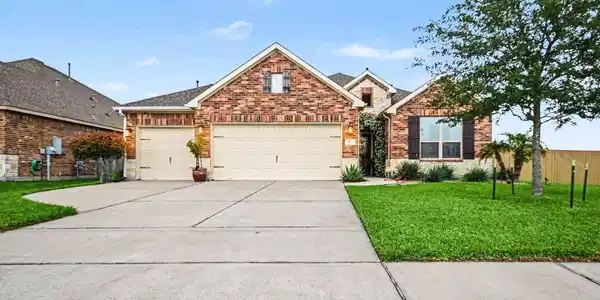Image 3: This photo showcases a charming single-story brick