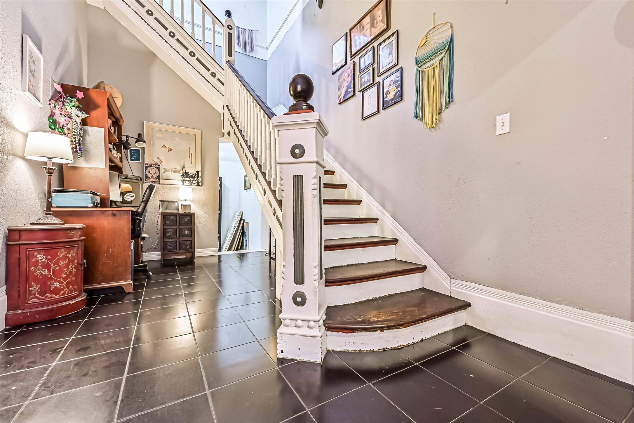 Image 4: Entryway with Staircase is Located Just Inside the