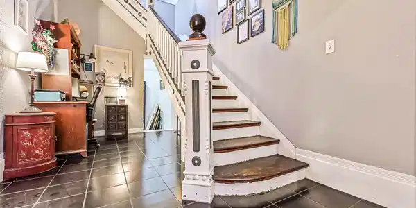 Image 4: Entryway with Staircase is Located Just Inside the