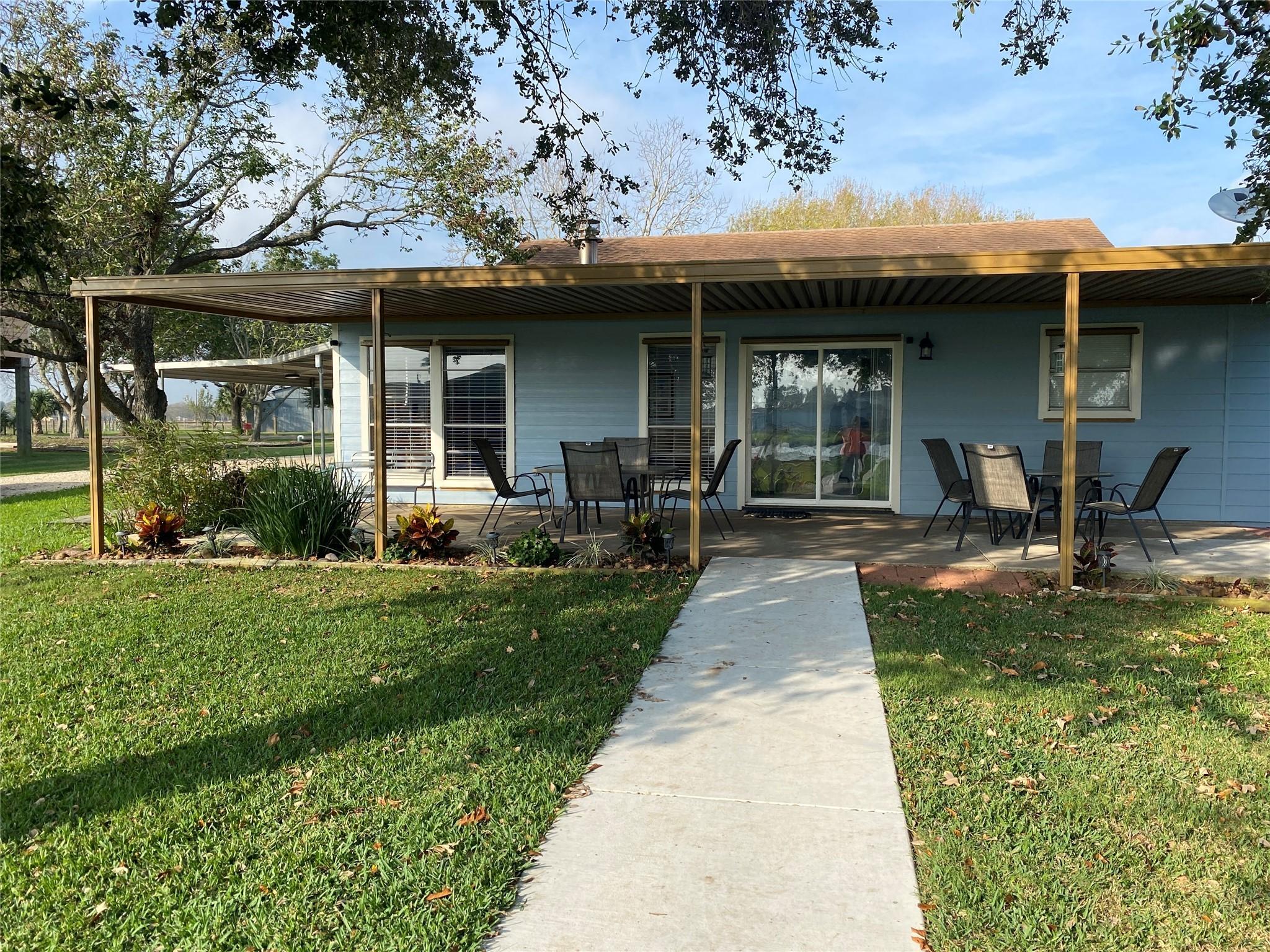 Image 2: Back Patio With Relaxing Porch, overlooking the hu
