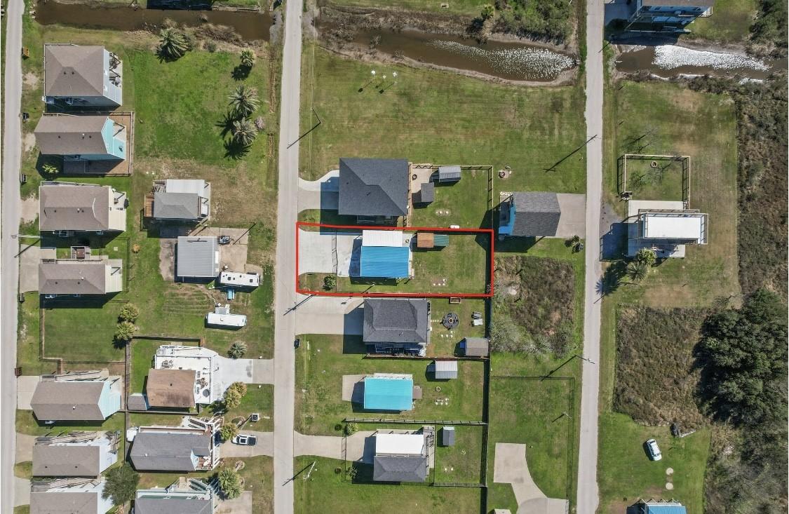 Image 3: This aerial photo shows a residential property out