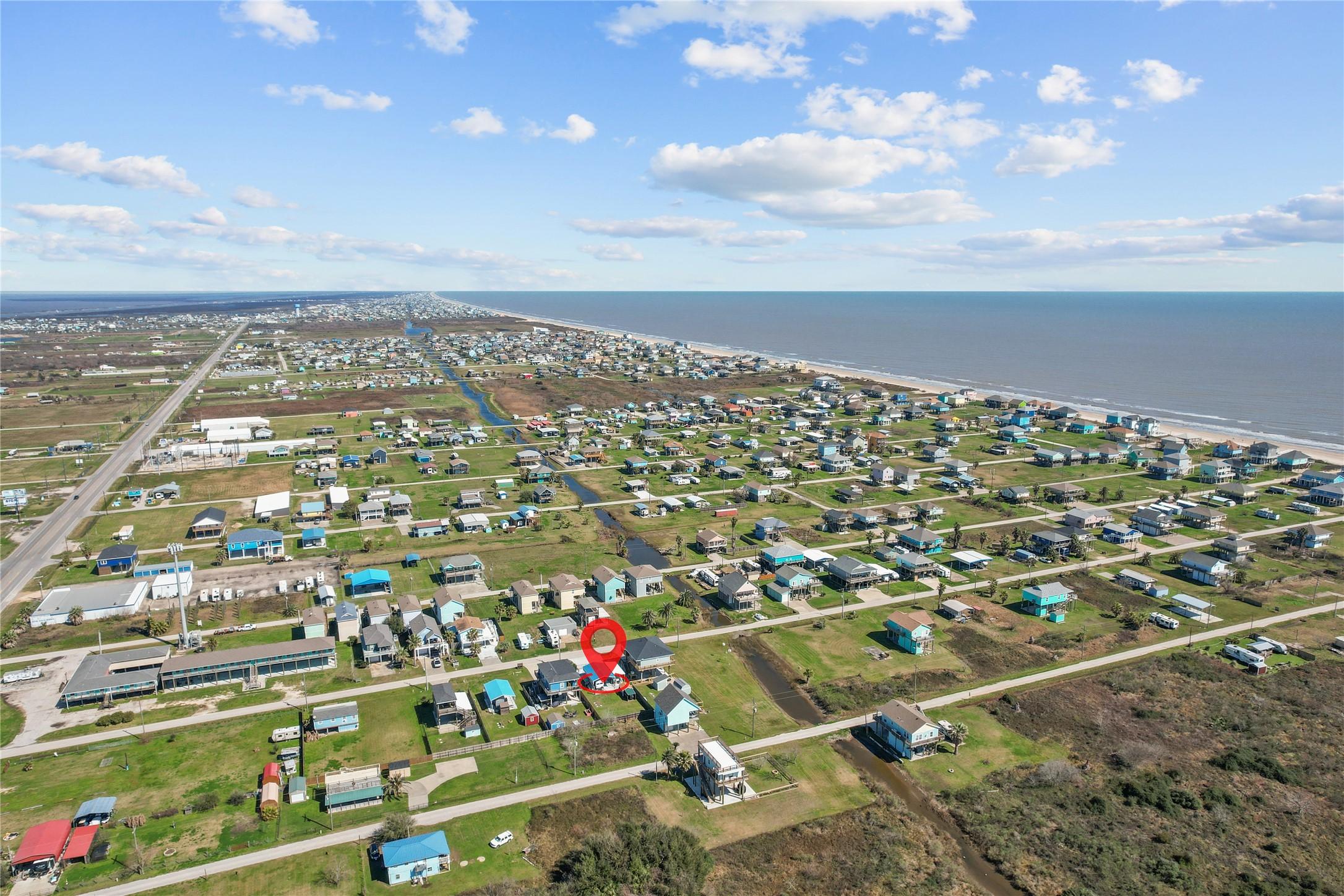 Image 4: This aerial photo showcases a coastal neighborhood
