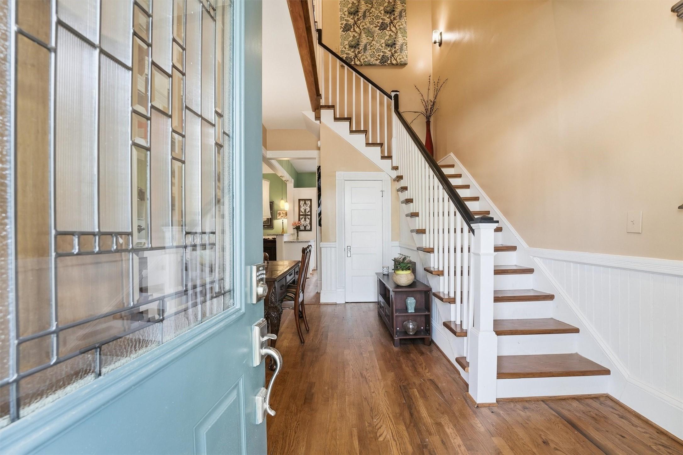 Image 3: Welcoming entry foyer featuring original wood floo