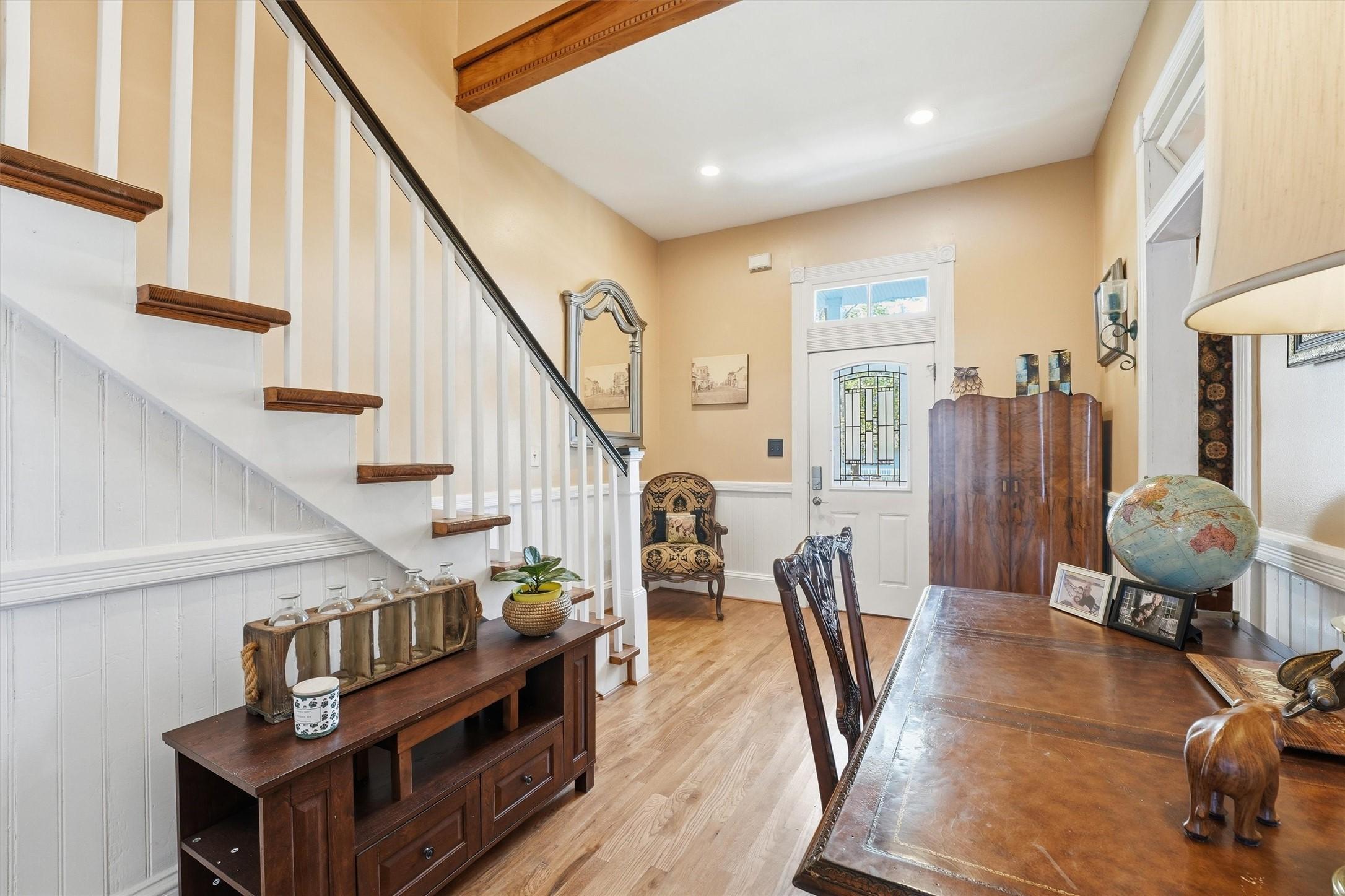 Image 4: Spacious foyer with high ceilings, natural light,