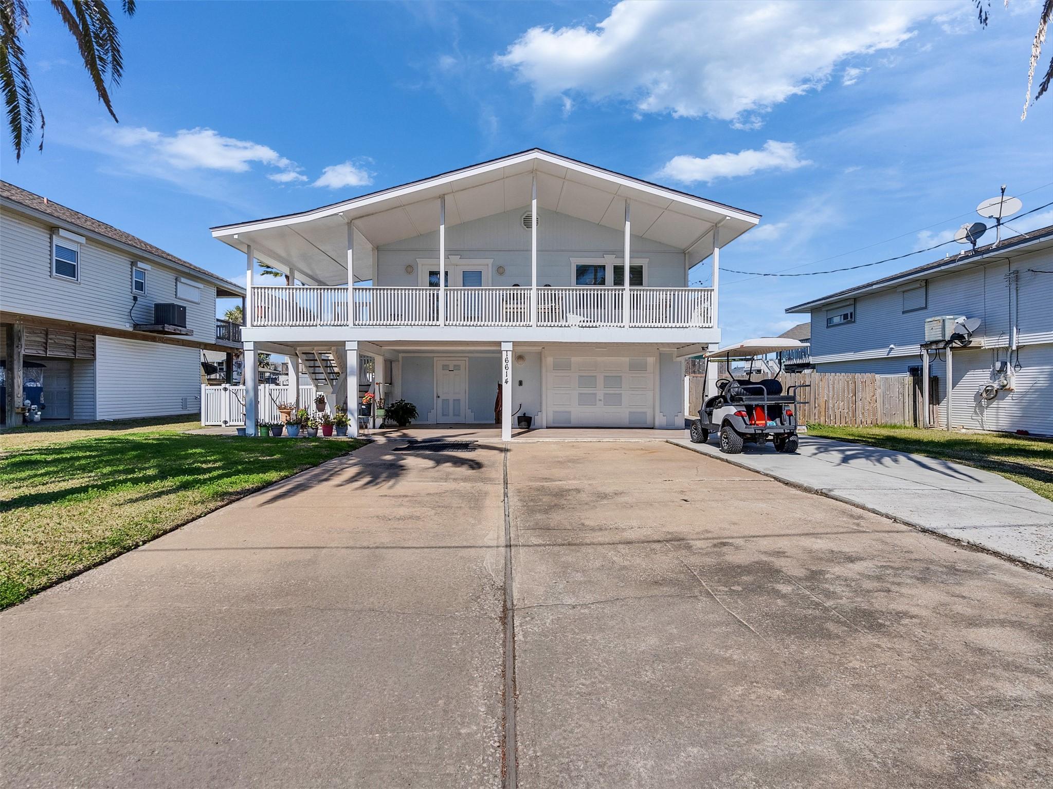 Image 3: Front of home facing north toward bay