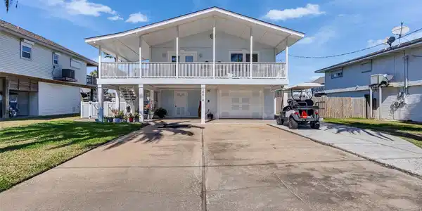 Image 3: Front of home facing north toward bay