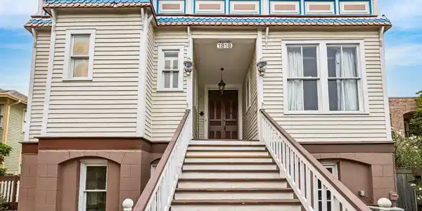 Image 4: Grand staircase leading you the front entry