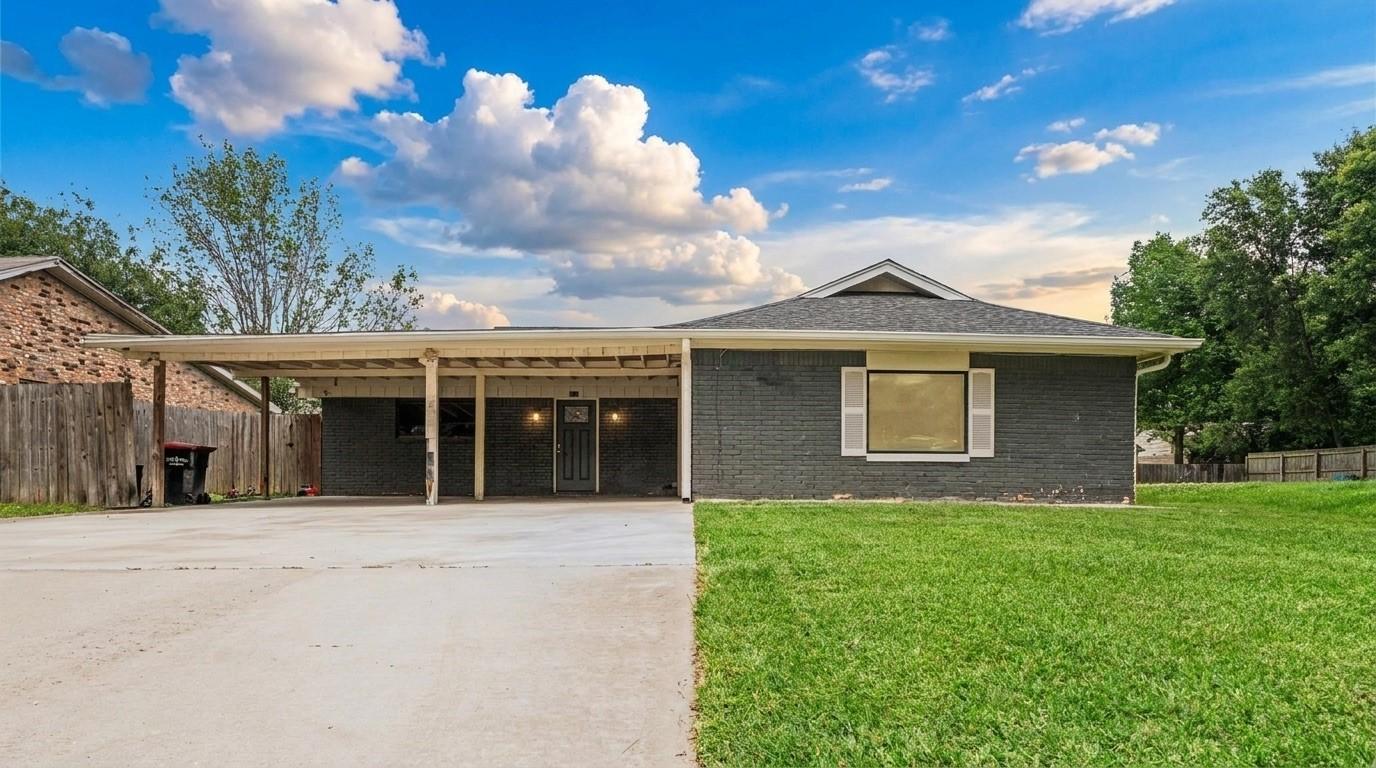 Image 1: Four-sided brick home with no HOA