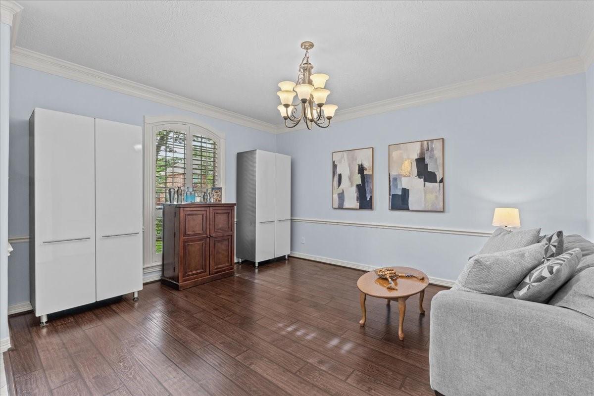 Image 4: Just inside the front door is a living room or din