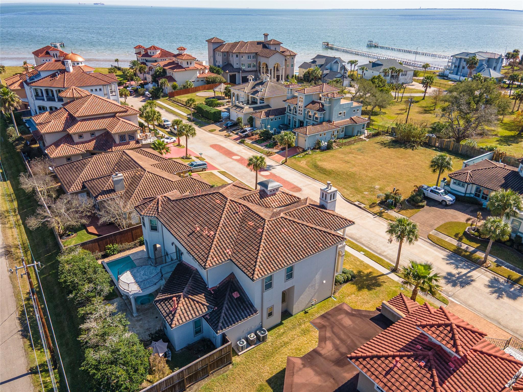 Image 2: This aerial photo showcases a coastal neighborhood