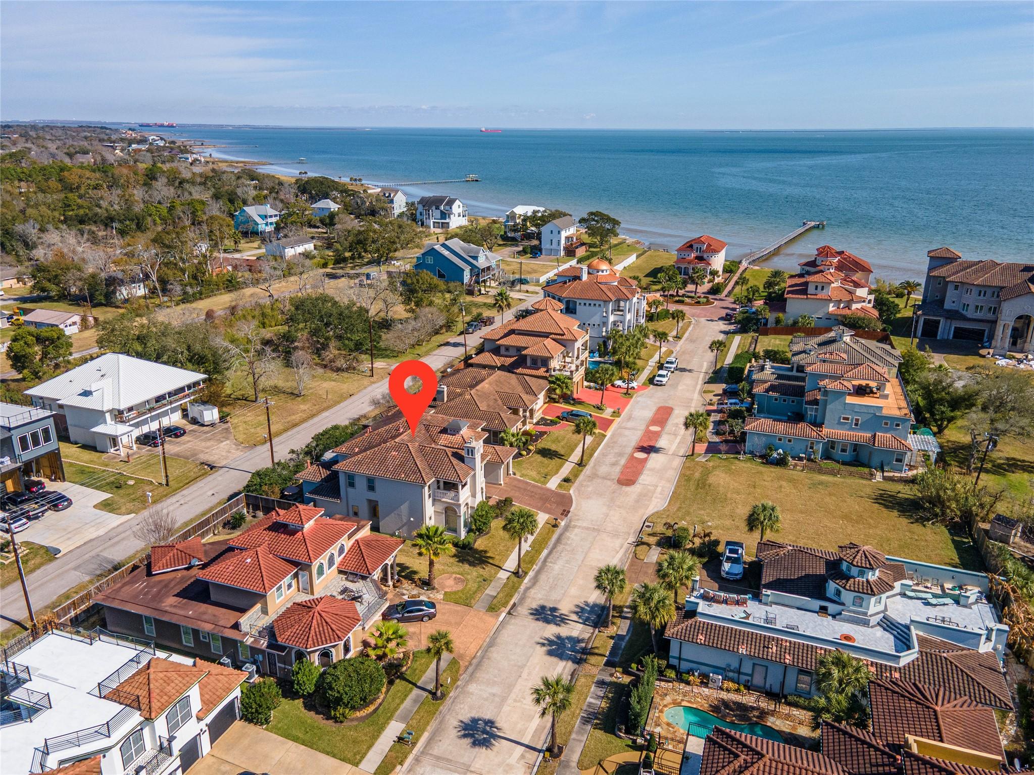 Image 4: This aerial photo showcases a coastal neighborhood