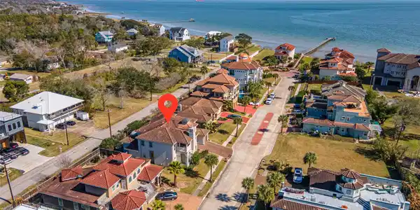 Image 4: This aerial photo showcases a coastal neighborhood