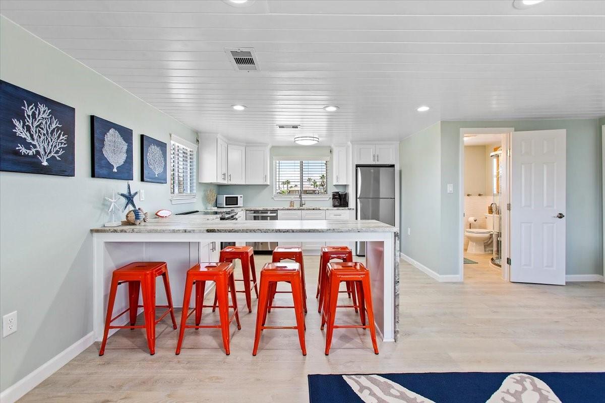 Image 3: Fully remodeled kitchen with extended seating