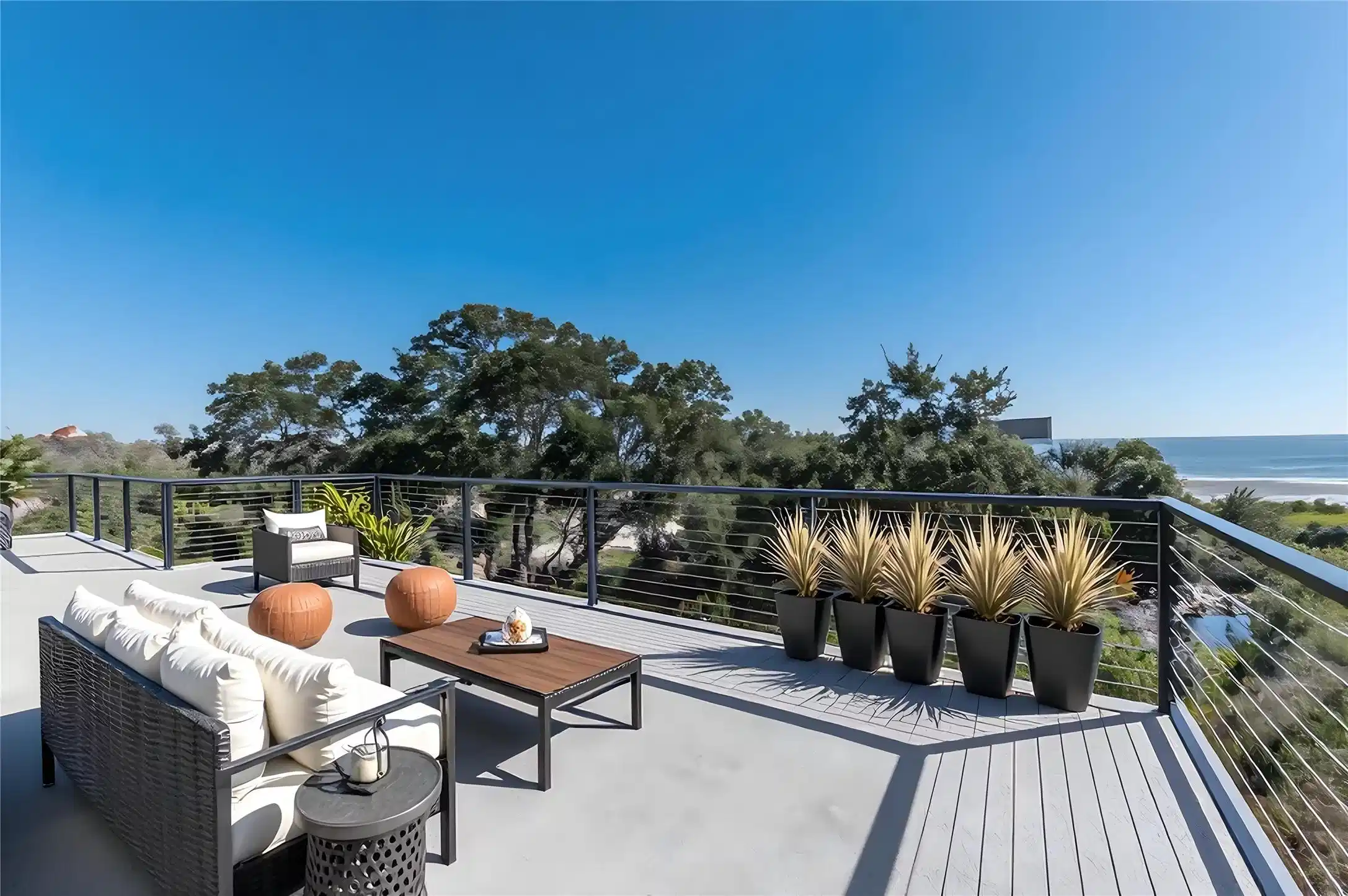 Image 1: This spacious outdoor deck offers stunning ocean v