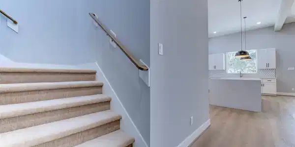 Image 2: This photo features a modern, open-concept home wi