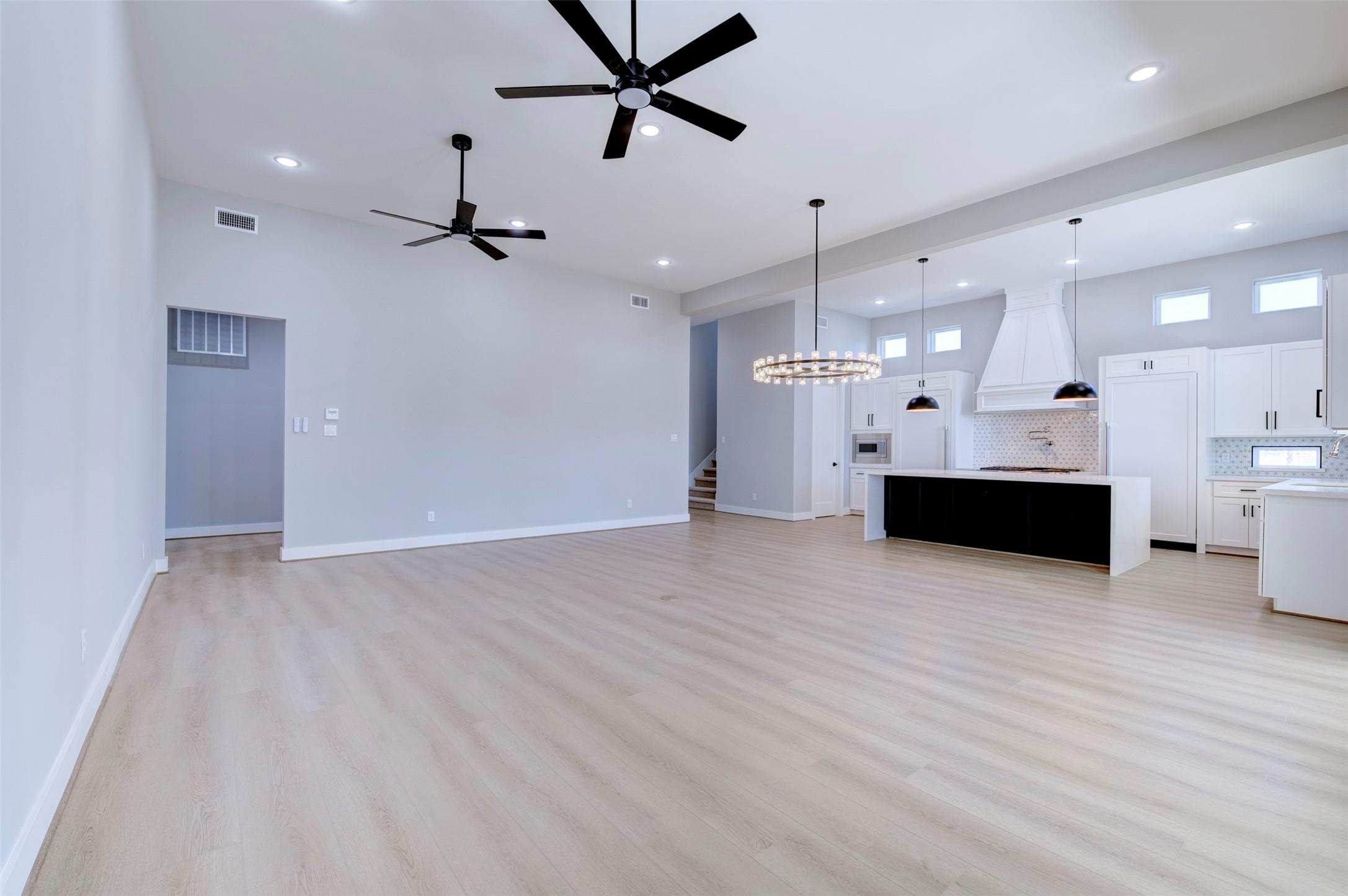 Image 3: This photo showcases a spacious, open-concept livi