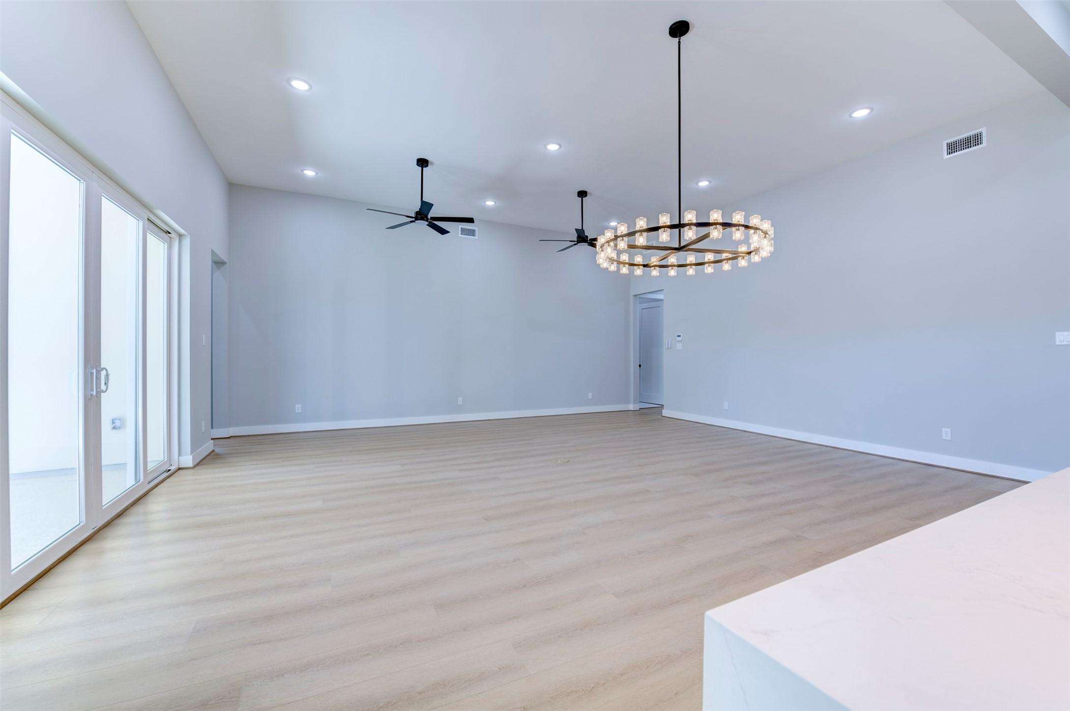 Image 4: This spacious living area features light wood floo