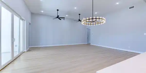 Image 4: This spacious living area features light wood floo