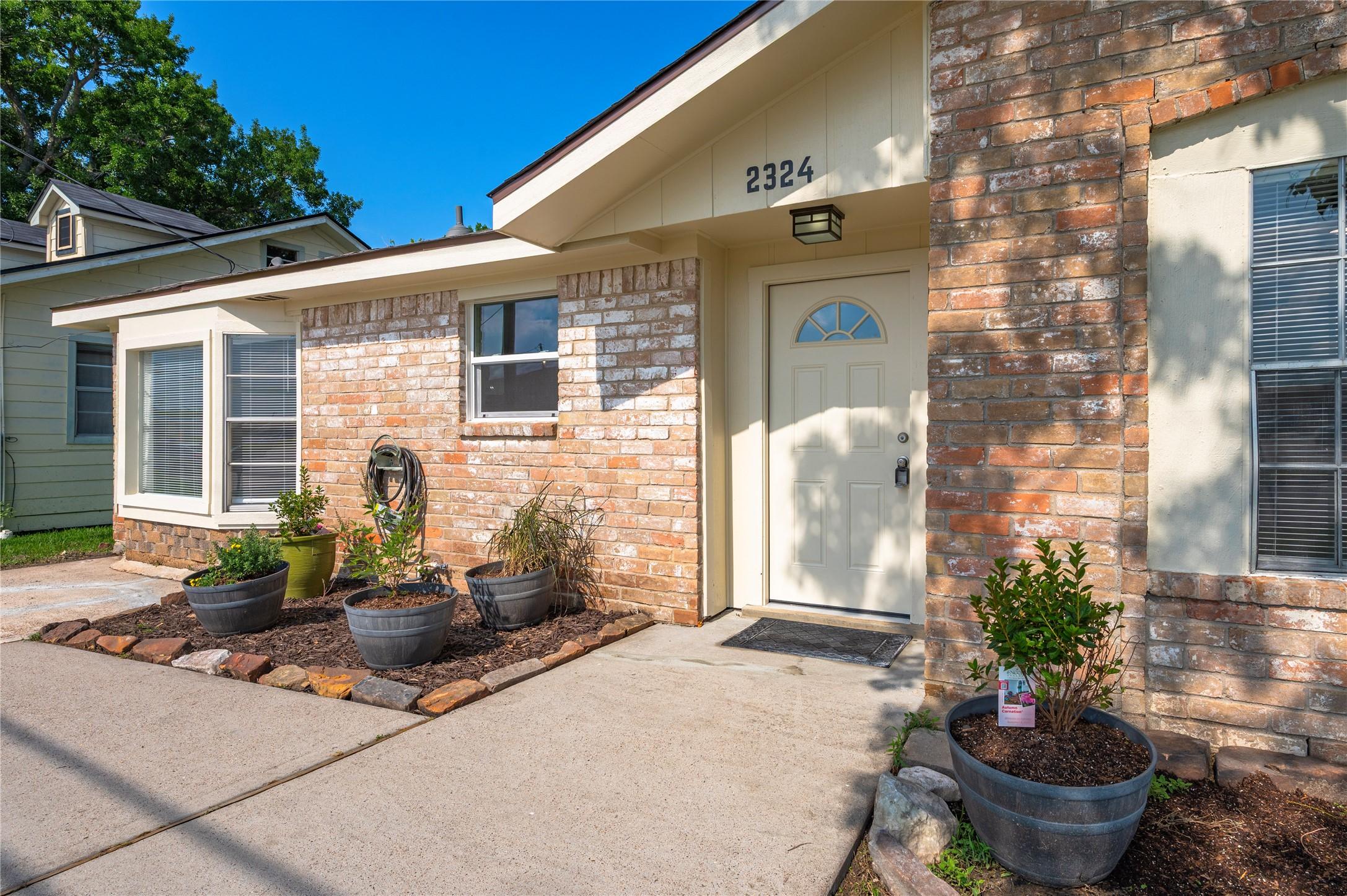 Image 3: Walkway leading up to the front of the home with w