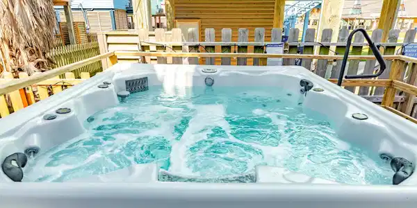 Image 2: Relax in your own hot tub oasis, complete with a s