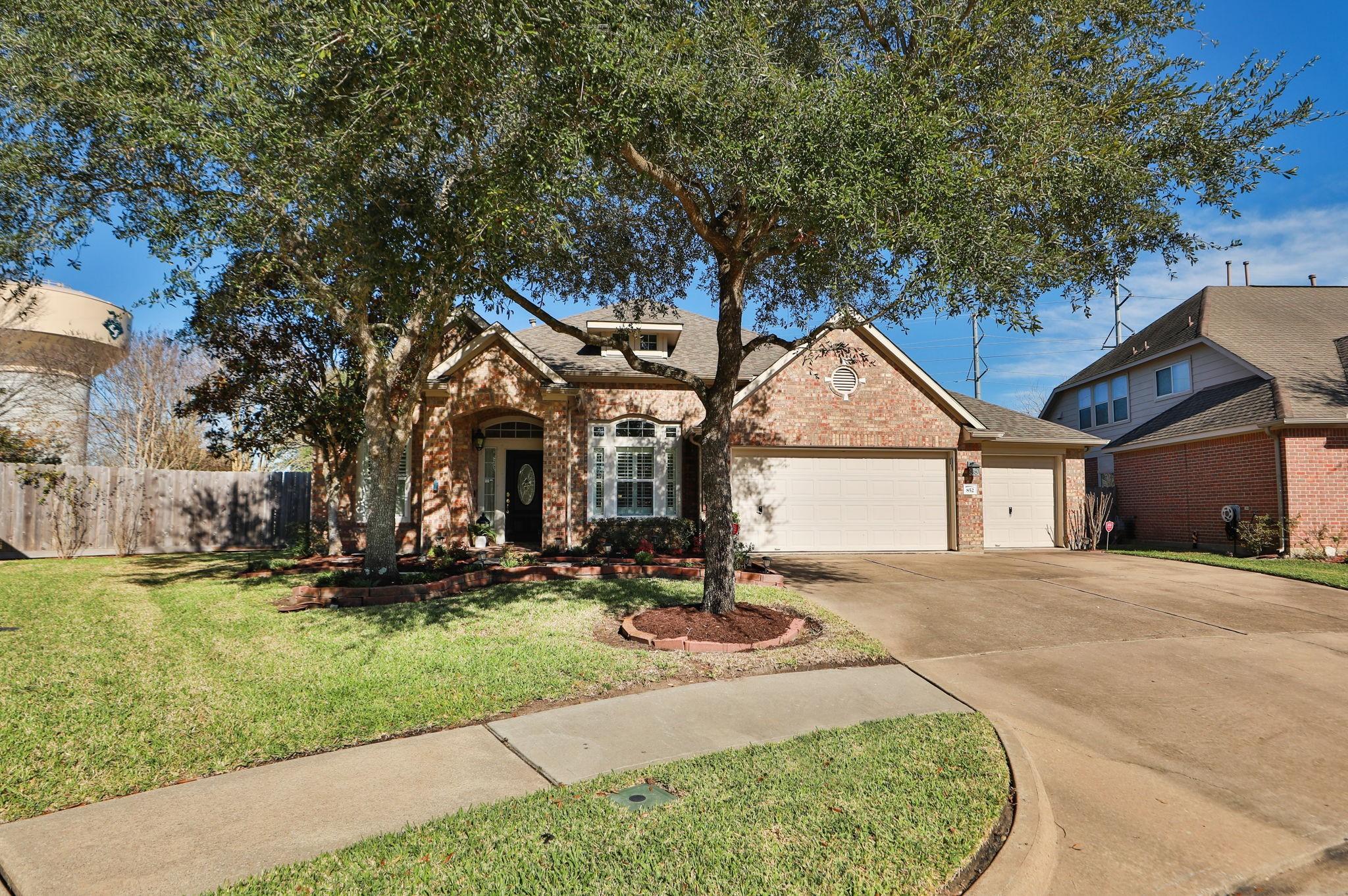 Image 1: This charming home welcomes you with a beautifully
