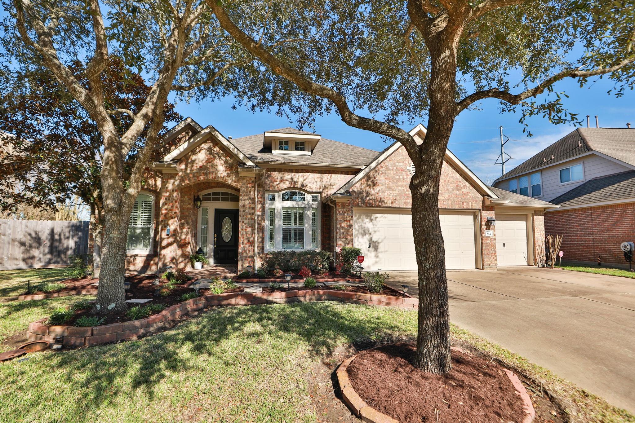 Image 4: This charming home boasts exceptional curb appeal