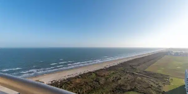 Image 3: Stunning views from the beachfront balcony to the