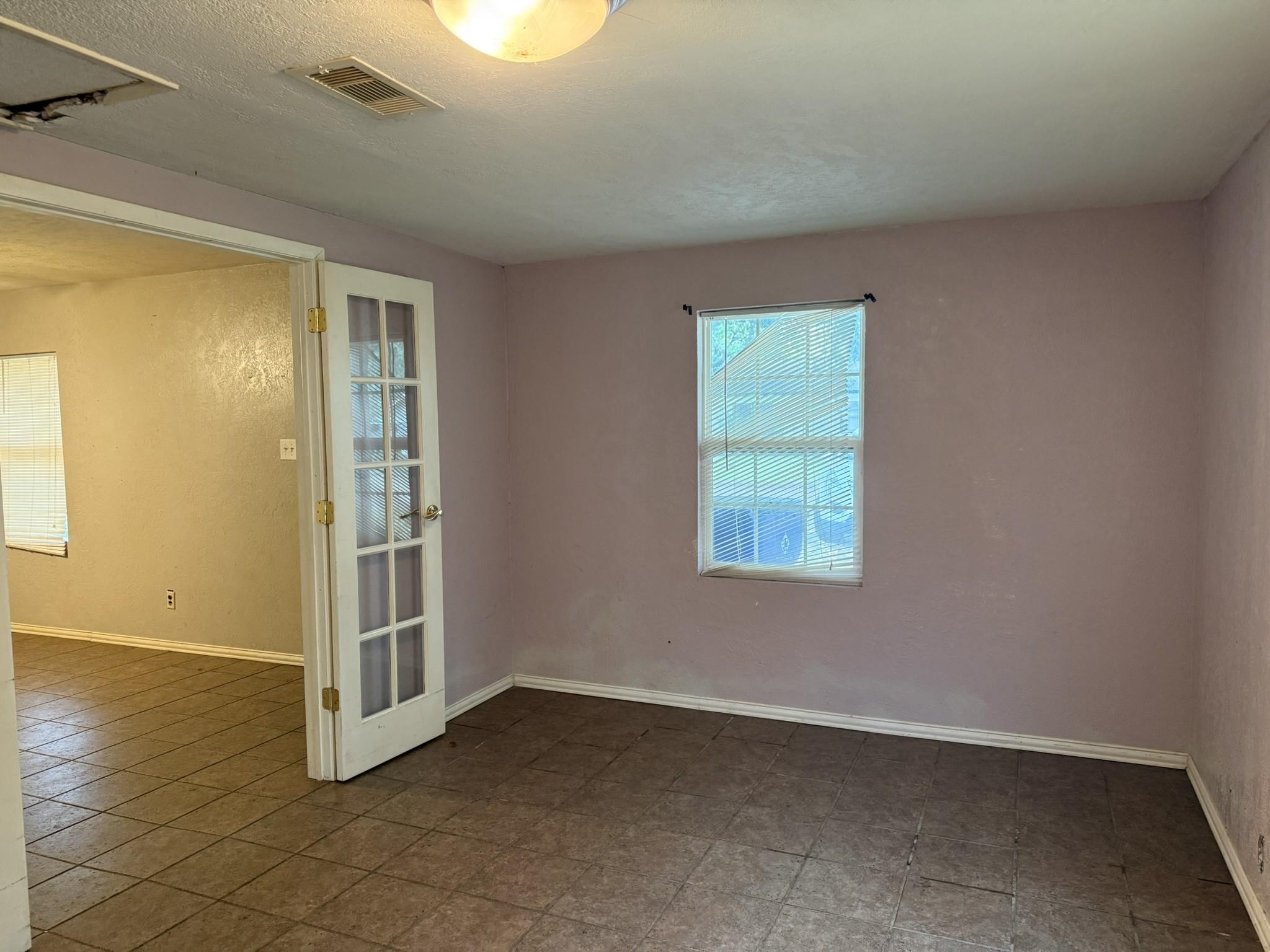 Image 4: Optional 3rd bedroom or family room. Has a closet!