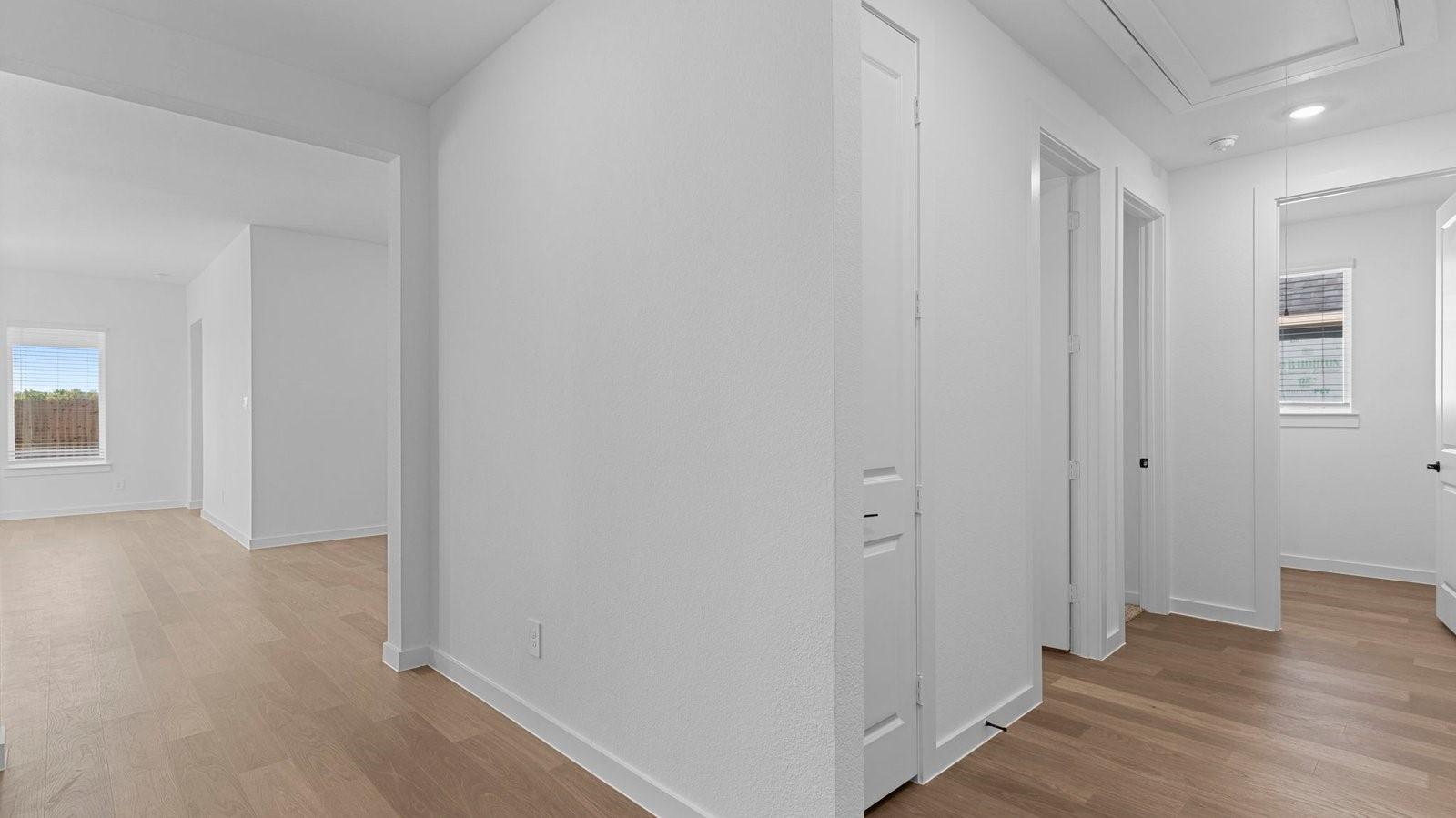 Image 4: Entry hallway leading to bedrooms in the backgroun