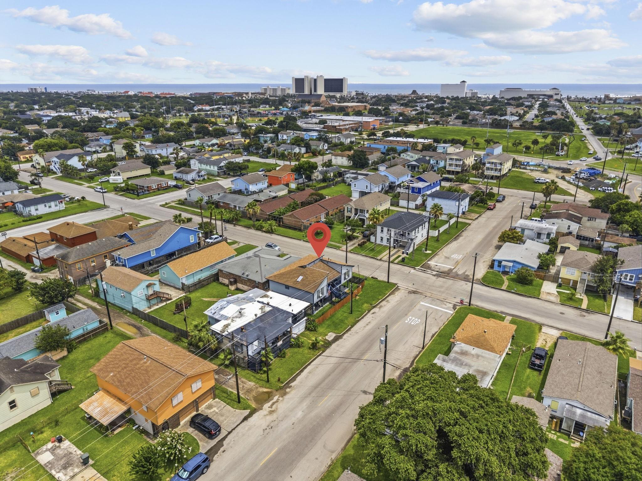 Image 2: Charming neighborhood with colorful homes, situate