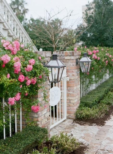 Image 3: The cast-iron front gate and fencing surrounding t