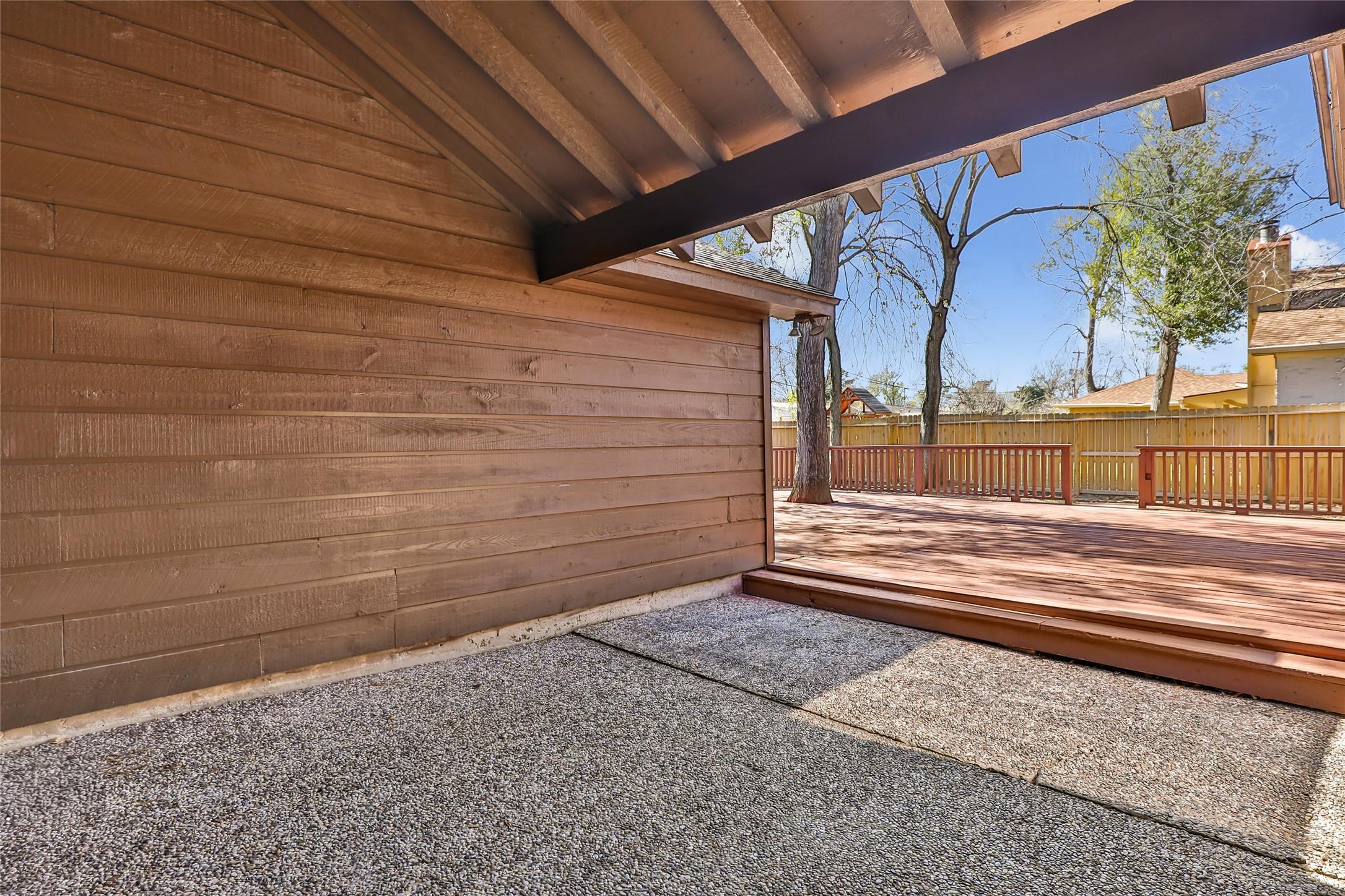 Image 3: Covered patio that leads to the expansive back dec