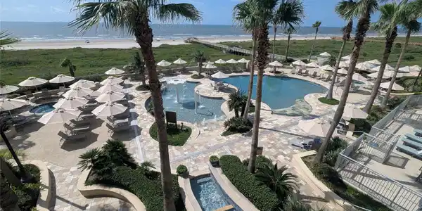 Image 3: Enjoy the resort pool deck featuring two pools, tw