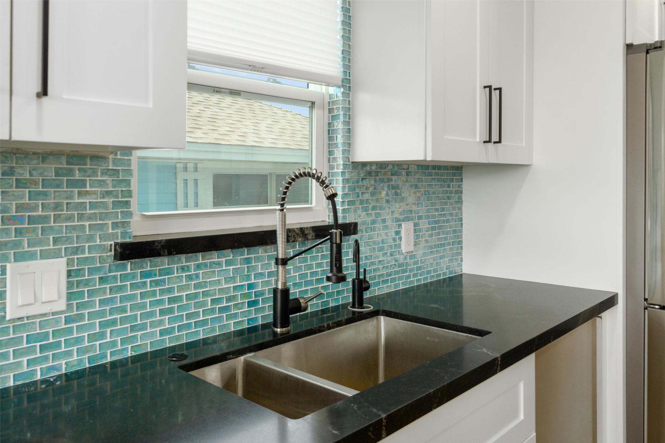 Image 2: Notice the custom coastal-inspired backsplash that