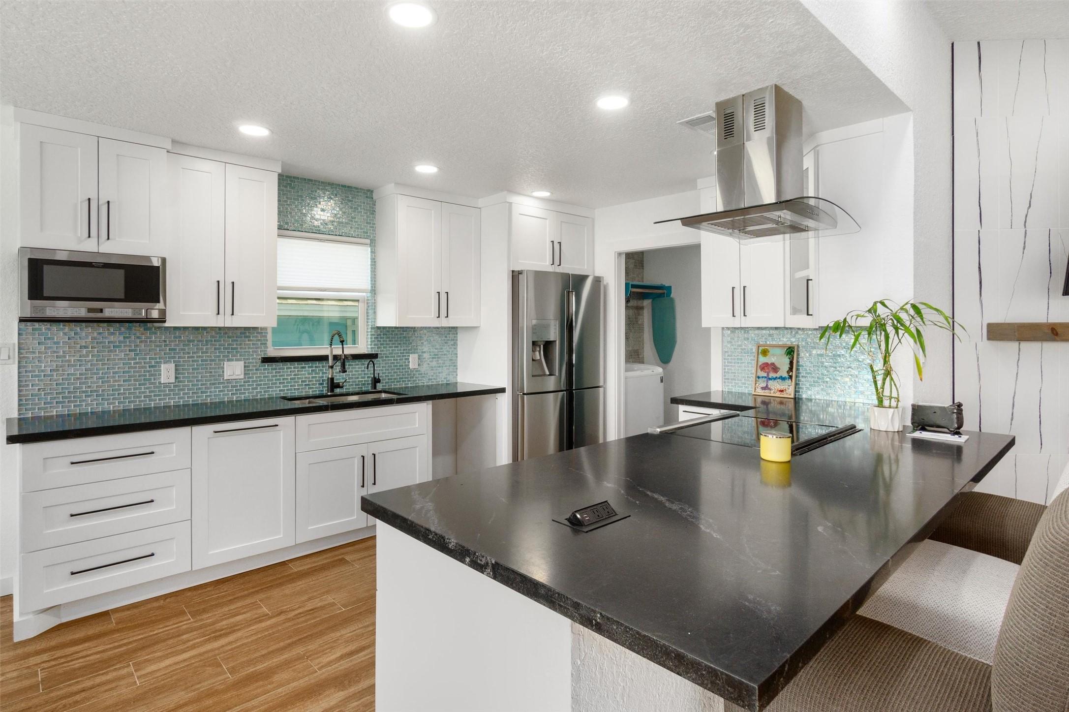 Image 3: The kitchen is a true showstopper, designed so the
