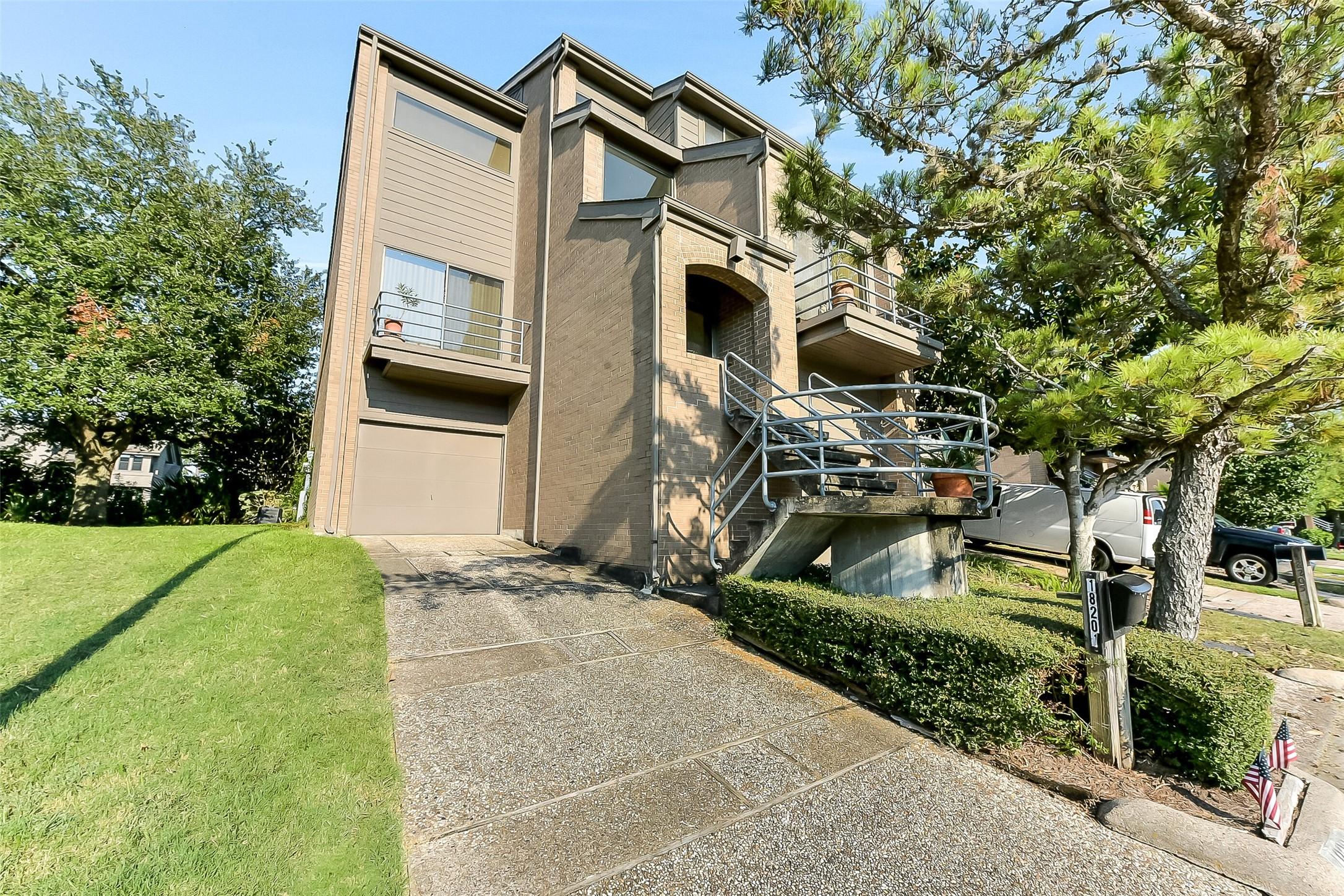 Image 3: Front of the townhome showing the greenspace to th