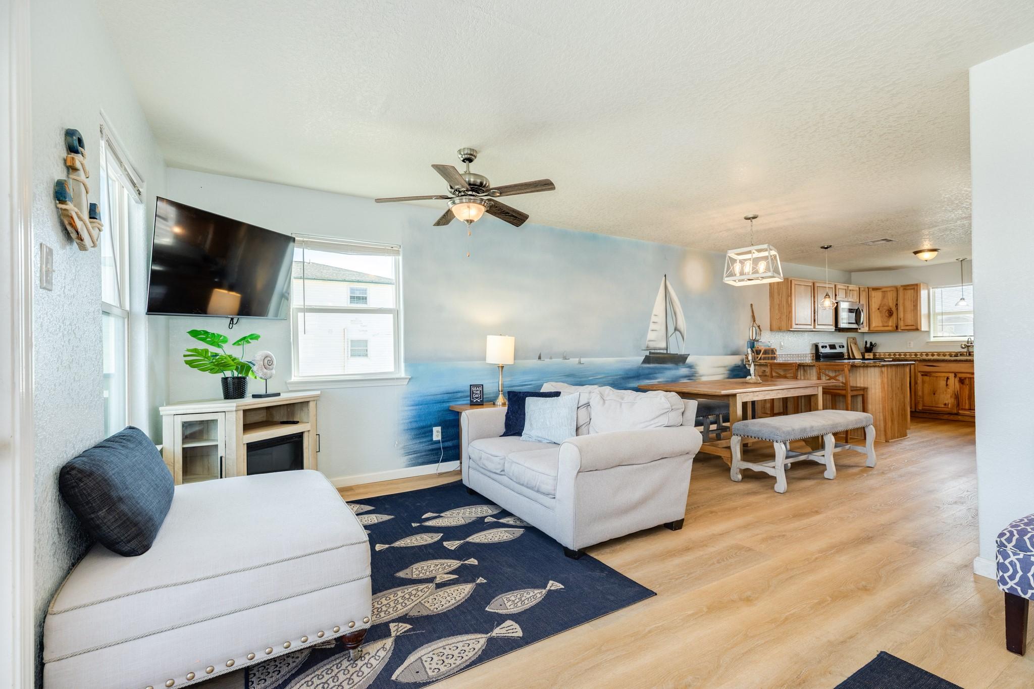 Image 4: Spacious open-concept layout connecting the living