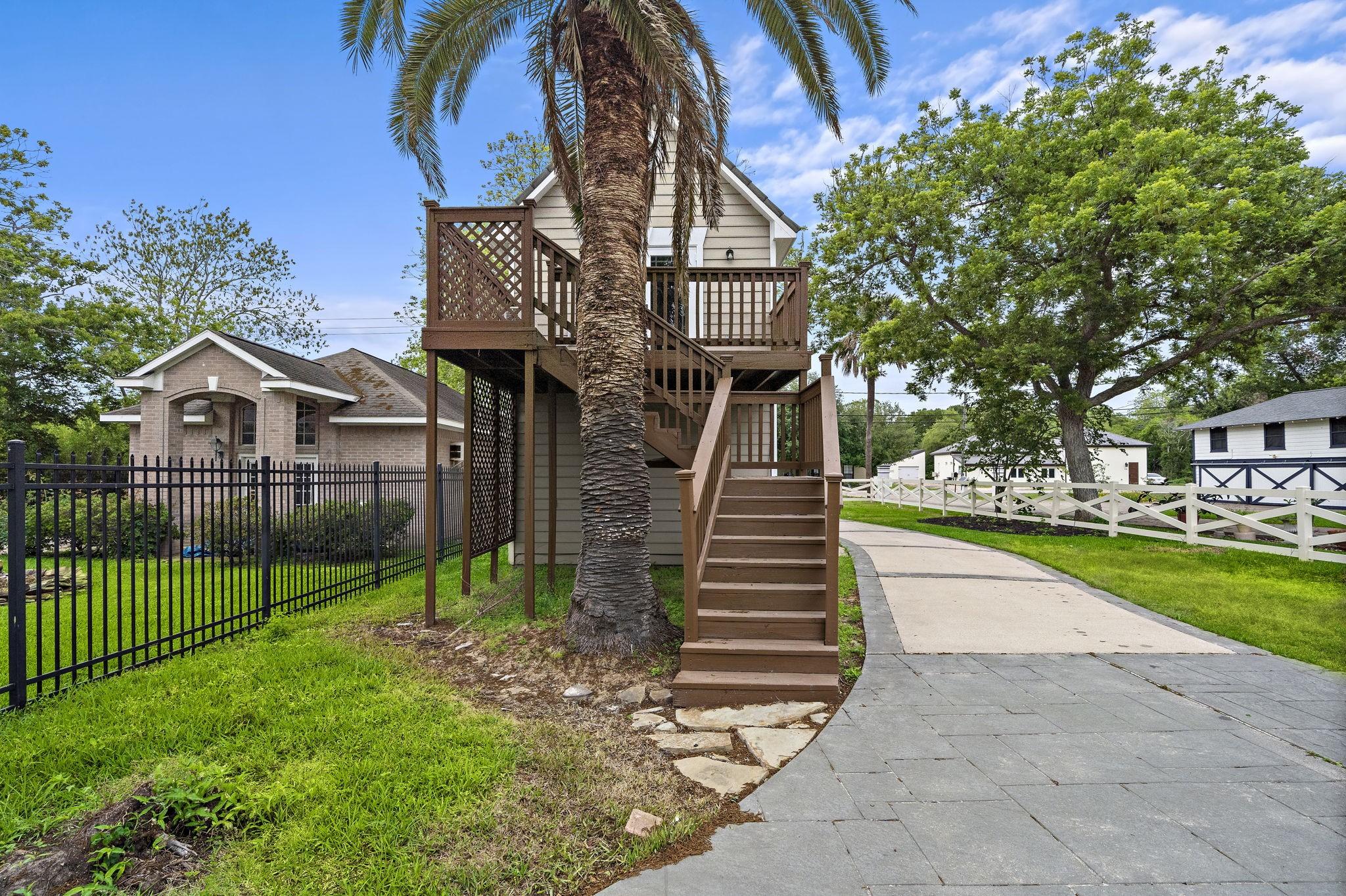 Image 2: Detached garage building with staircase going to t