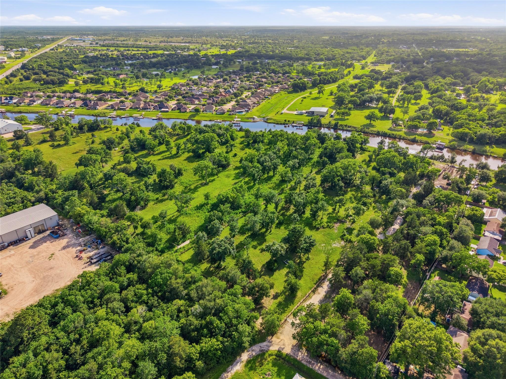 Image 4: Lush green area with scattered trees.