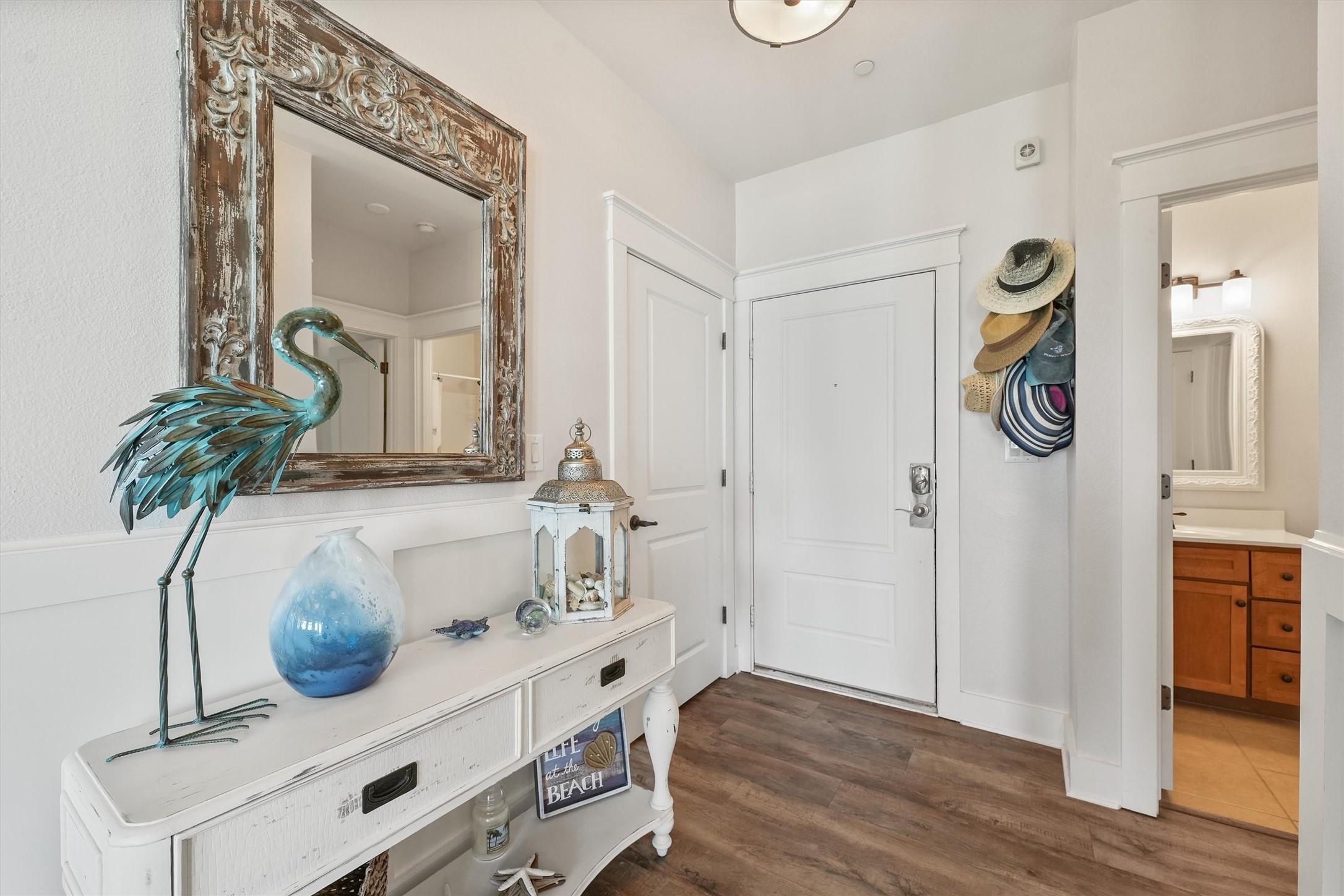 Image 4: Step into a fresh and inviting entry that sets the