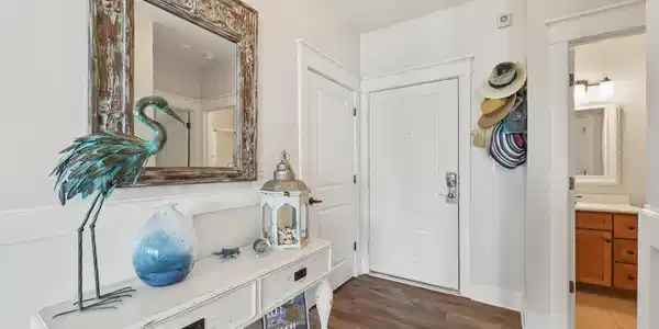 Image 4: Step into a fresh and inviting entry that sets the