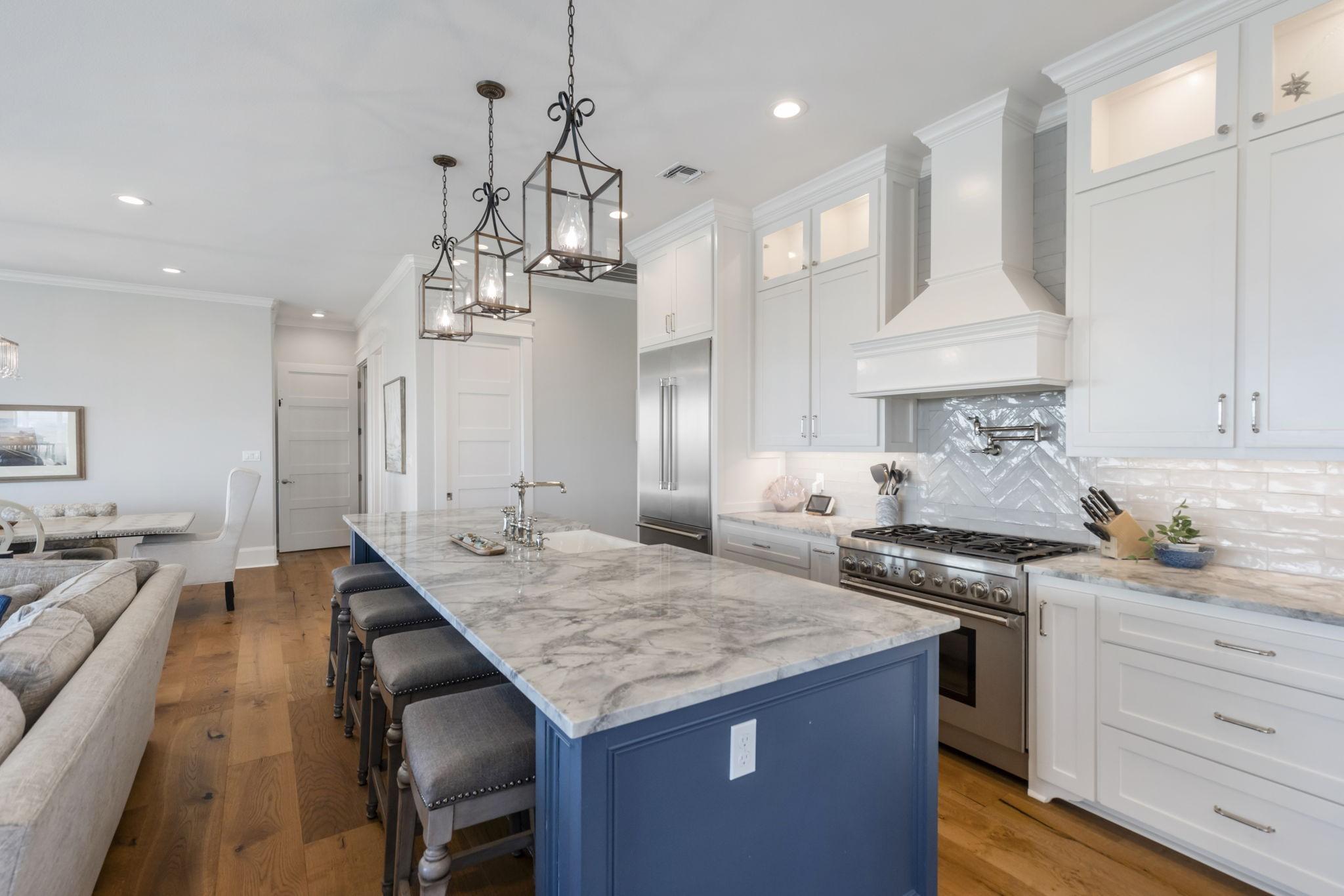 Image 3: Spacious kitchen with oversized island bar. Farmho