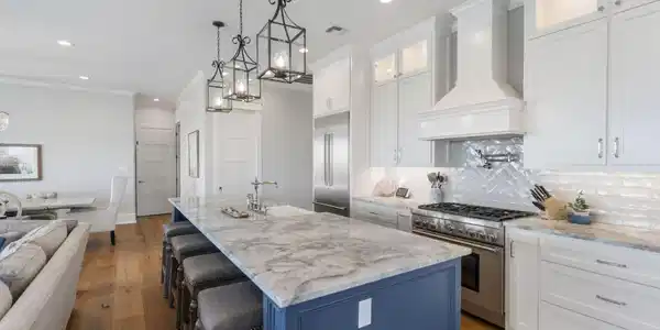 Image 3: Spacious kitchen with oversized island bar. Farmho