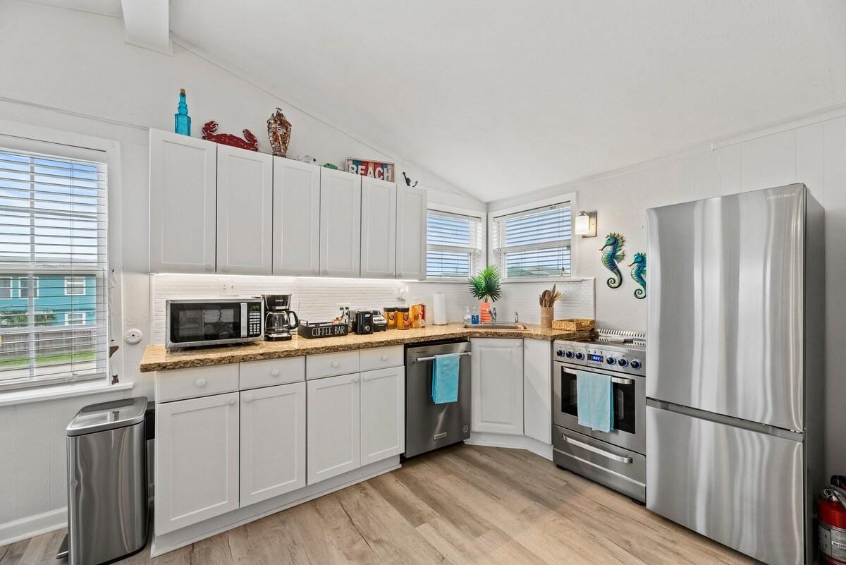 Image 4: Kitchen - As you can see, this home soaks in natur