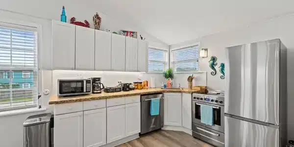 Image 4: Kitchen - As you can see, this home soaks in natur
